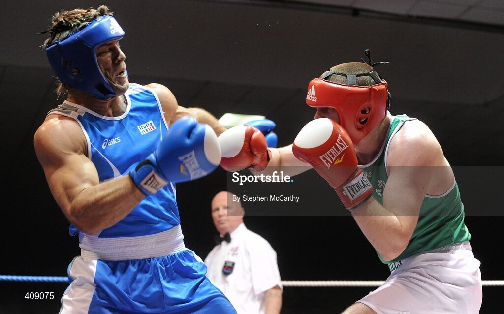 12 March 2010; Con Sheehan, Ireland, exchanges punches with Clemente Russo, Italy, during their 91kg bout. Elite International, National Stadium, Dublin. Picture credit: Stephen McCarthy / SPORTSFILE