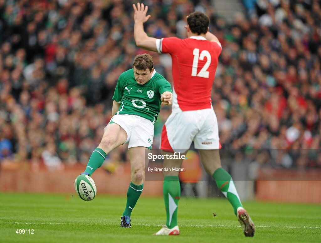 13 March 2010; Brian O'Driscoll, Ireland, kicks through against Jamie Roberts, Wales. RBS Six Nations Rugby Championship, Ireland v Wales, Croke Park, Dublin. Picture credit: Brendan Moran / SPORTSFILE