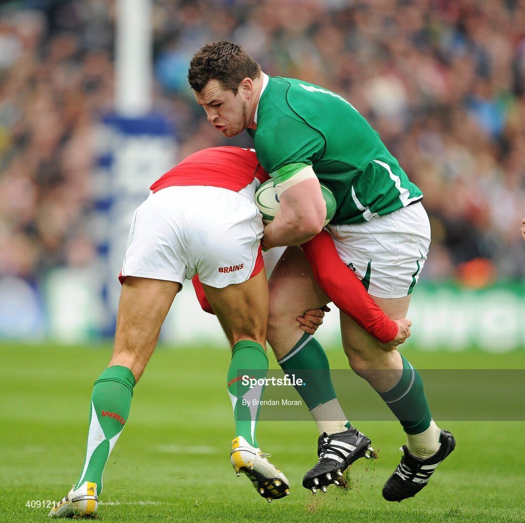 13 March 2010; Cian Healy, Ireland, is tackled by James Hook, Wales. RBS Six Nations Rugby Championship, Ireland v Wales, Croke Park, Dublin. Picture credit: Brendan Moran / SPORTSFILE