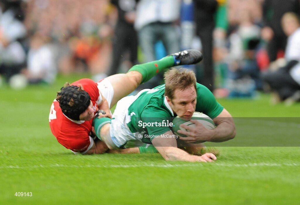 13 March 2010; Tomas O'Leary, Ireland, is tackled by Leigh Halfpenny, Wales, as he goes over to score his side's second try. RBS Six Nations Rugby Championship, Ireland v Wales, Croke Park, Dublin. Picture credit: Stephen McCarthy / SPORTSFILE