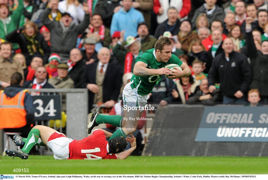 13 March 2010; Tomas O'Leary, Ireland, slips past Leigh Halfpenny, Wales, on his way to scoring a try in the 31st minute. RBS Six Nations Rugby Championship, Ireland v Wales, Croke Park, Dublin. Picture credit: Ray McManus / SPORTSFILE