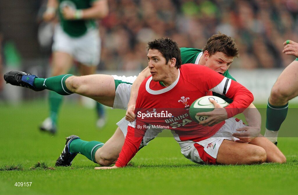 13 March 2010; James Hook, Wales, is tackled by Brian O'Driscoll. RBS Six Nations Rugby Championship, Ireland v Wales, Croke Park, Dublin. Picture credit: Ray McManus / SPORTSFILE