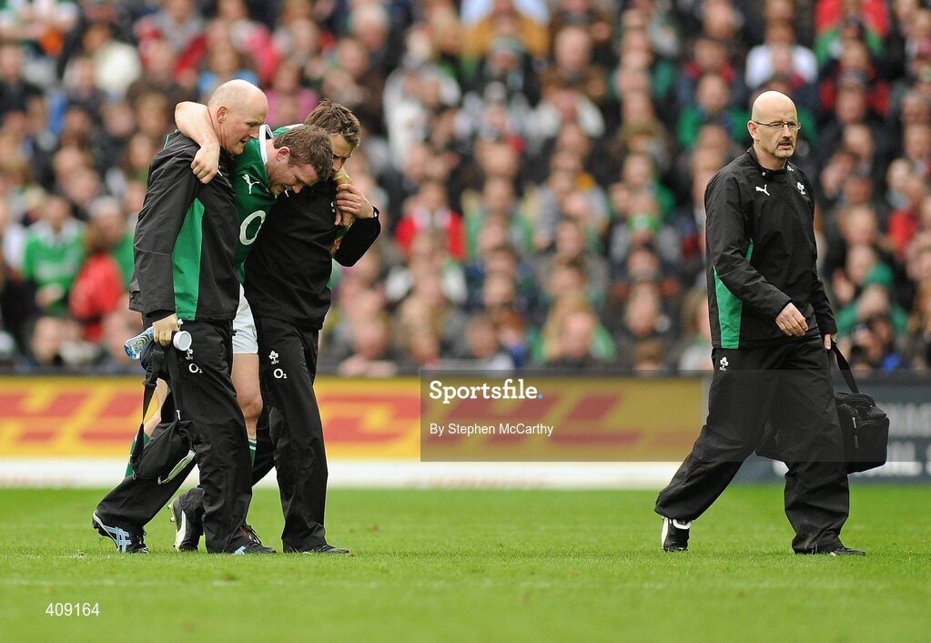 13 March 2010; Gordon D'Arcy, Ireland, is helped off the pitch after picking up an injury. RBS Six Nations Rugby Championship, Ireland v Wales, Croke Park, Dublin. Picture credit: Stephen McCarthy / SPORTSFILE