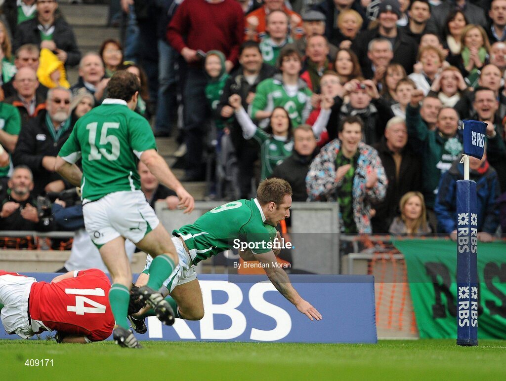 13 March 2010; Tomas O'Leary, Ireland, on the way to scoring his side's second try, despite the efforts of Leigh Halfpenny, Wales. RBS Six Nations Rugby Championship, Ireland v Wales, Croke Park, Dublin. Picture credit: Brendan Moran / SPORTSFILE