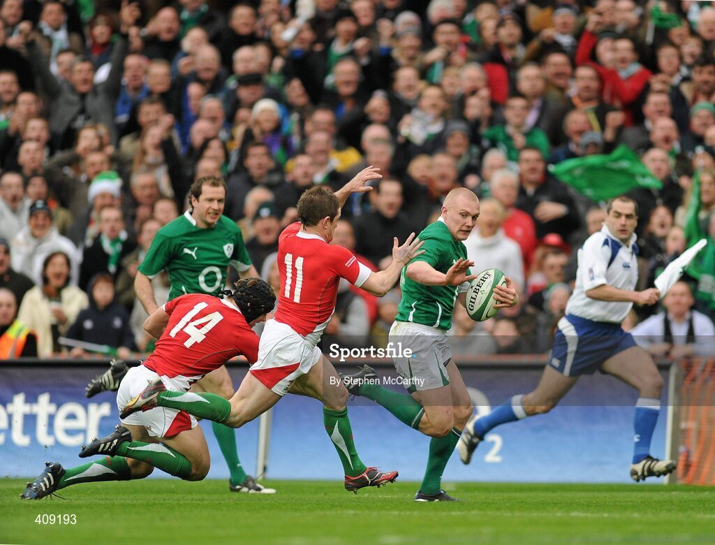 13 March 2010; Keith Earls, Ireland, on his way to scoring his second, and his side's thid try, despite the efforts of Shane Williams, 11, and Leigh Halfpenny, Wales. RBS Six Nations Rugby Championship, Ireland v Wales, Croke Park, Dublin. Picture credit: Stephen McCarthy / SPORTSFILE