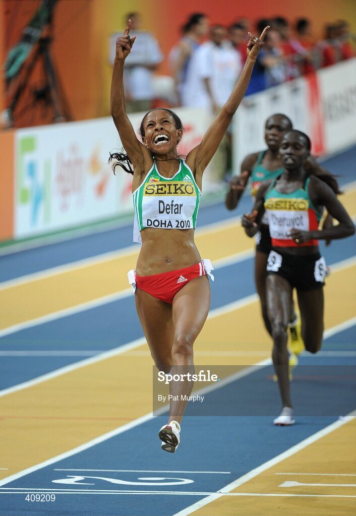13 March 2010; Meseret Defar, Ethiopia, celebrates as she crosses the finish line to win the Women's 3000m Final at the 13th IAAF World Indoor Athletics Championships, Doha, Qatar. Picture credit: Pat Murphy / SPORTSFILE