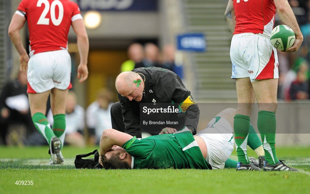 13 March 2010; Ireland's Cian Healy is atteneded to by team doctor Dr. Jim McShane. RBS Six Nations Rugby Championship, Ireland v Wales, Croke Park, Dublin. Picture credit: Brendan Moran / SPORTSFILE