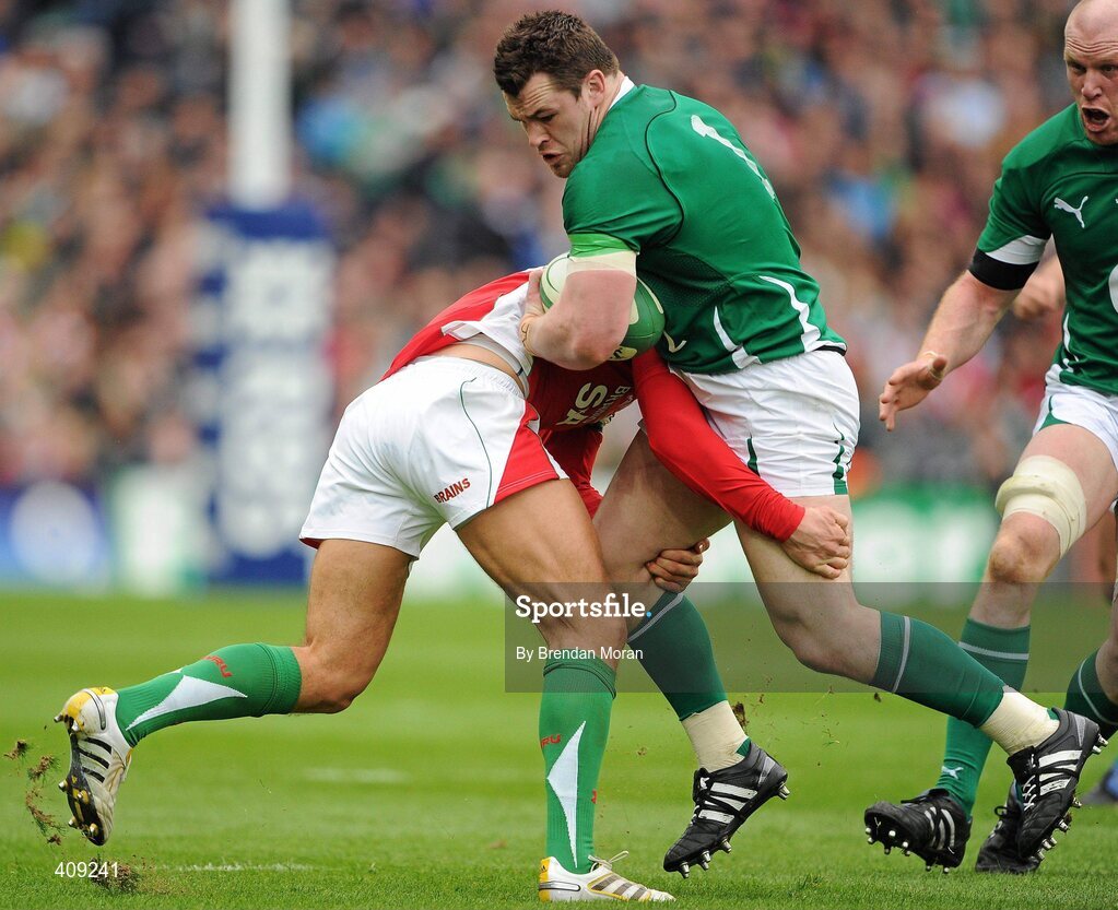 13 March 2010; Cian Healy, Ireland, is tackled by James Hook, Wales. RBS Six Nations Rugby Championship, Ireland v Wales, Croke Park, Dublin. Picture credit: Brendan Moran / SPORTSFILE