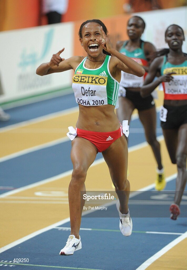13 March 2010; Meseret Defar, Ethiopia, celebrates after crossing the finish line to win the Women's 3000m Final at the 13th IAAF World Indoor Athletics Championships, Doha, Qatar. Picture credit: Pat Murphy / SPORTSFILE