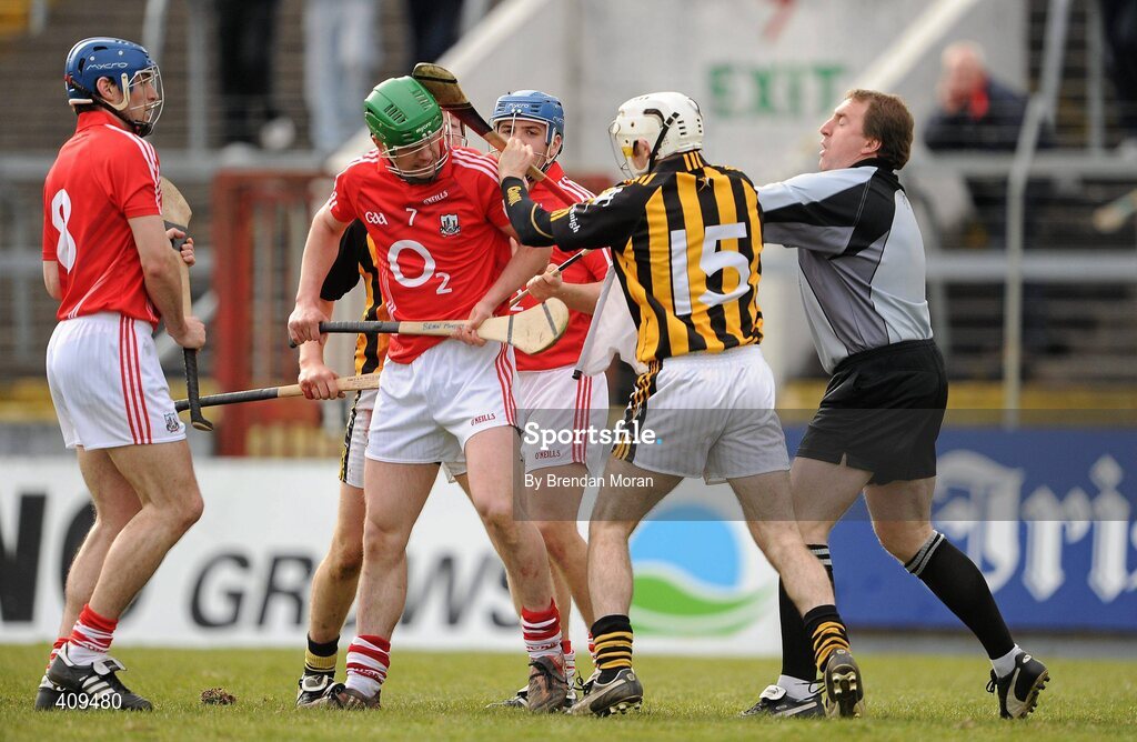 14 March 2010; Linesman Michael Wadding attempts to separate Michael Grace, 15, Kilkenny, and Brian Murphy, 7, Cork. Subsequently Michael Grace was shown a red card by referee Dickie Murphy. Allianz GAA Hurling National League, Division 1, Round 3, Cork v Kilkenny, Pairc Ui Chaoimh, Cork. Picture credit: Brendan Moran / SPORTSFILE