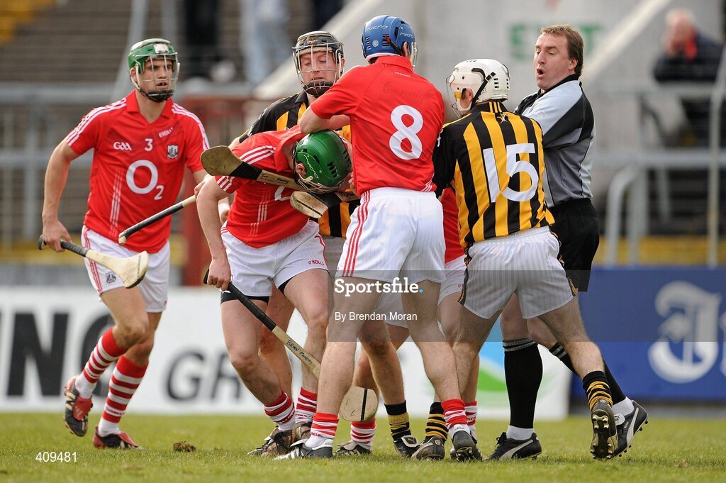 14 March 2010; Linesman Michael Wadding attempts to separate Michael Grace, 15, Kilkenny, and Brian Murphy, 2nd from left, Cork. Subsequently Michael Grace was shown a red card by referee Dickie Murphy. Allianz GAA Hurling National League, Division 1, Round 3, Cork v Kilkenny, Pairc Ui Chaoimh, Cork. Picture credit: Brendan Moran / SPORTSFILE