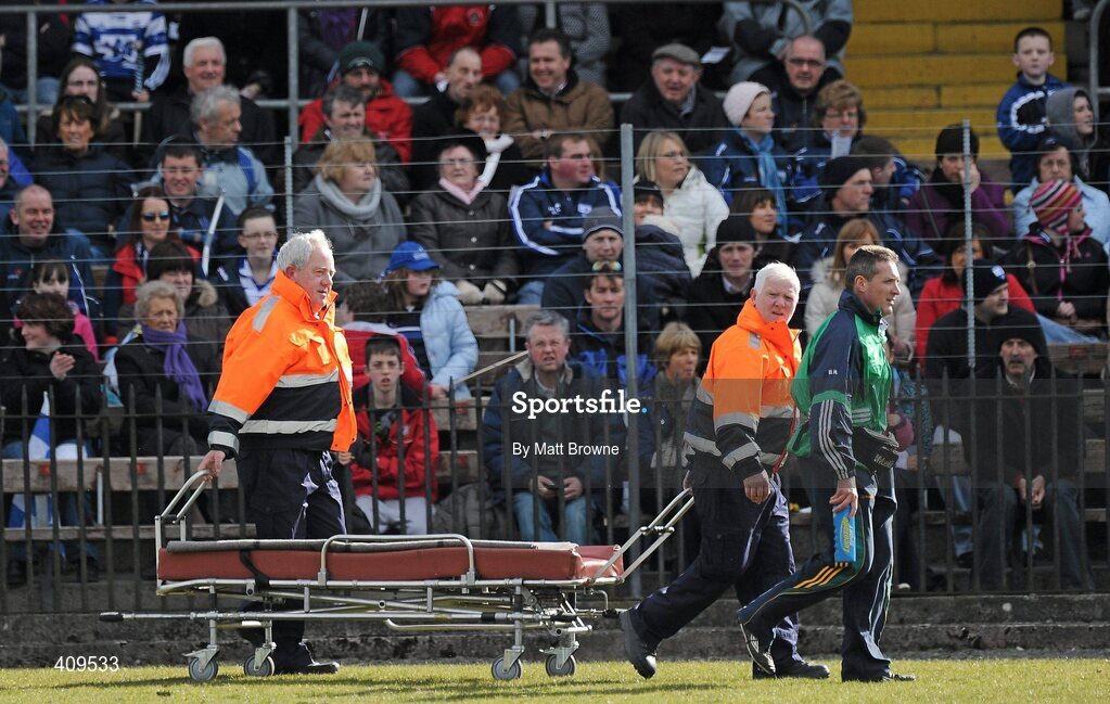 14 March 2010; Members of the Civil Defence Force make their way down the pitch to Limerick goalkeeper Tadhg Flynn, who was injured during the game. Allianz GAA Hurling National League, Division 1, Round 3, Waterford v Limerick, Fraher Field, Dungarvan, Co. Waterford. Picture credit: Matt Browne / SPORTSFILE
