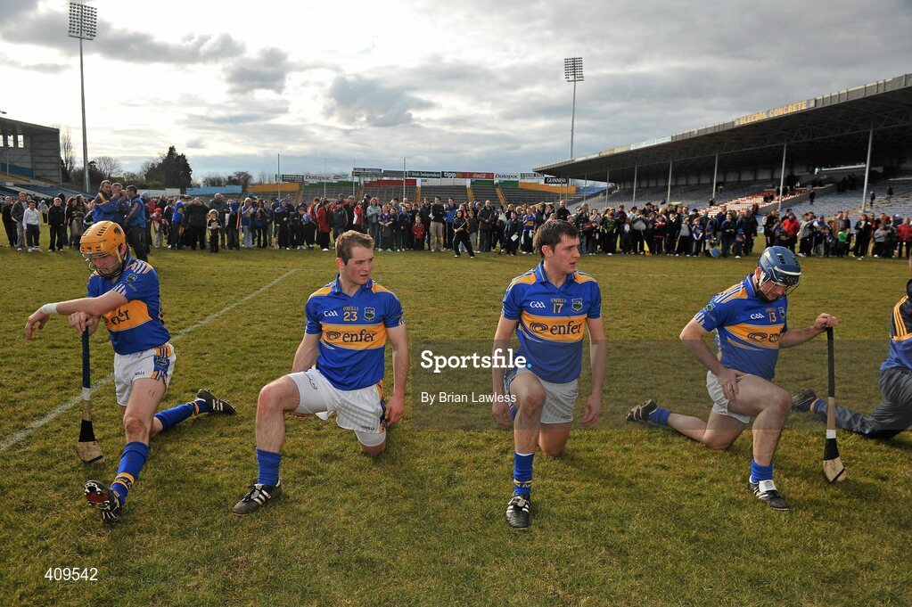 14 March 2010; Tipperary players, from left, Shane McGrath, Gearóid Ryan, Seamus Callanan, and Eoin Kelly, warm down as supporters and autograph hunters await them. Allianz GAA Hurling National League, Division 1, Round 3, Tipperary v Galway, Semple Stadium, Thurles, Co. Tipperary. Picture credit: Brian Lawless / SPORTSFILE