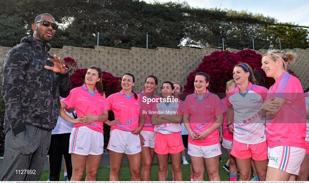 19 March 2016; Former Miami Dolphin NFL football player  Roberto Wallace speaks to Ladies All Stars, from left, Ciara Hegarty, Donegal, Caroline Kelly, Kerry, Aislinn Desmond, Kerry, Sarah Houlihan, Kerry, Sinead Finnegan, Dublin, Geraldine McLaughlin, Donegal, Noelle Healy, Dublin, and Valerie Mulcahy, Cork, after the game. TG4 Ladies Football All-Star Tour, 2014 All Stars v 2015 All Stars. University of San Diego, Torero Stadium, San Diego, California, USA. Picture credit: Brendan Moran / SPORTSFILE