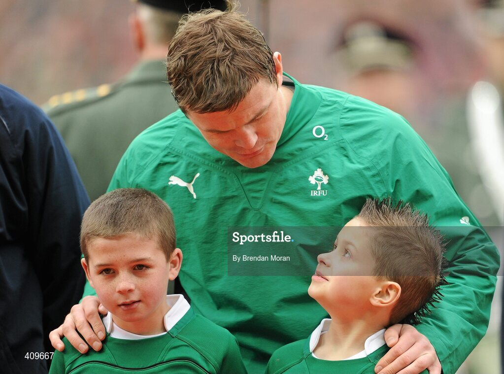 13 March 2010; Ireland captain Brian O'Driscoll, on the occasion of earning his 100th cap for Ireland, speaks to mascot Evan Moran, right, in the company of 2nd mascot Rossa Ryan, before the game. RBS Six Nations Rugby Championship, Ireland v Wales, Croke Park, Dublin. Picture credit: Brendan Moran / SPORTSFILE