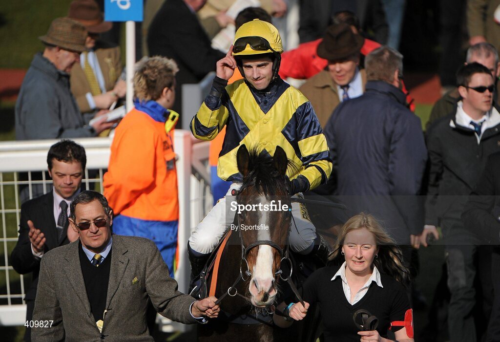 16 March 2010; Jockey Paddy Aspel celebrates as he enters the parade ring after winning the William Hill Trophy Handicap Chase on Chief Dan George. Cheltenham Racing Festival - Tuesday. Prestbury Park, Cheltenham, Gloucestershire, England. Photo by Sportsfile