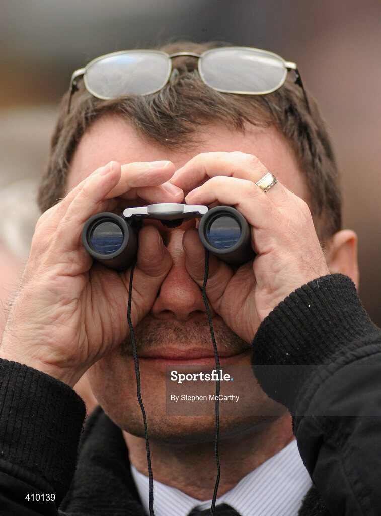 17 March 2010; A punter watches on during the 140th Year Of The National Hunt Chase Challenge Cup. Cheltenham Racing Festival - Wednesday. Prestbury Park, Cheltenham, Gloucestershire, England. Picture credit: Stephen McCarthy / SPORTSFILE