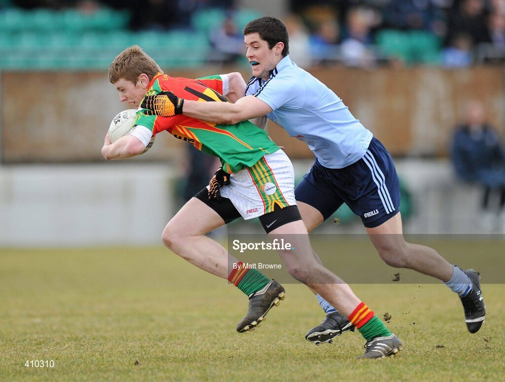 17 March 2010; Eddie Byrne, Carlow, is tackled by Rory O'Carroll, Dublin. Cadbury Leinster GAA Football Under 21 Semi-Final, Carlow v Dublin, Dr Cullen Park, Carlow. Picture credit: Matt Browne / SPORTSFILE
