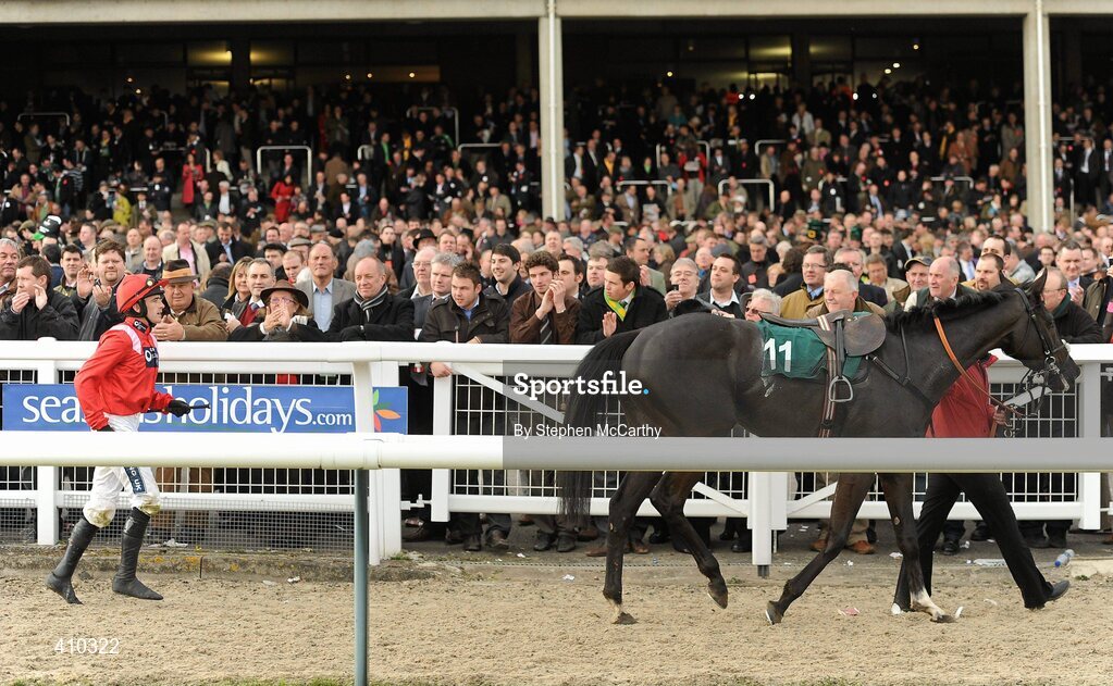 17 March 2010; Jockey Ruby Walsh catches up with his mount Sanctuaire following the horses refusal to leave the track after winning the Fred Winter Juvenile Novices' Handicap Hurdle. Cheltenham Racing Festival - Wednesday. Prestbury Park, Cheltenham, Gloucestershire, England. Picture credit: Stephen McCarthy / SPORTSFILE