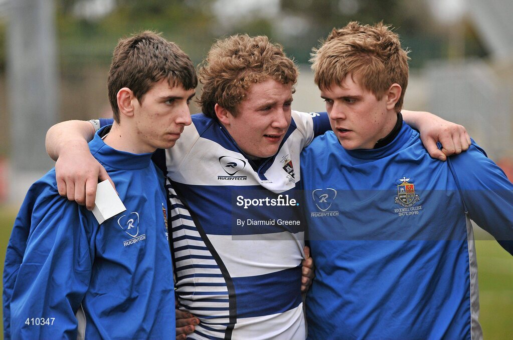 17 March 2010; A dejected Richard Moran, Rockwell College, centre, is supported by team-mates Ryan Murtagh, left, and MJ Murphy after defeat to PBC. Munster Schools Senior Cup Final, Rockwell College v PBC, Thomond Park, Limerick. Picture credit: Diarmuid Greene / SPORTSFILE