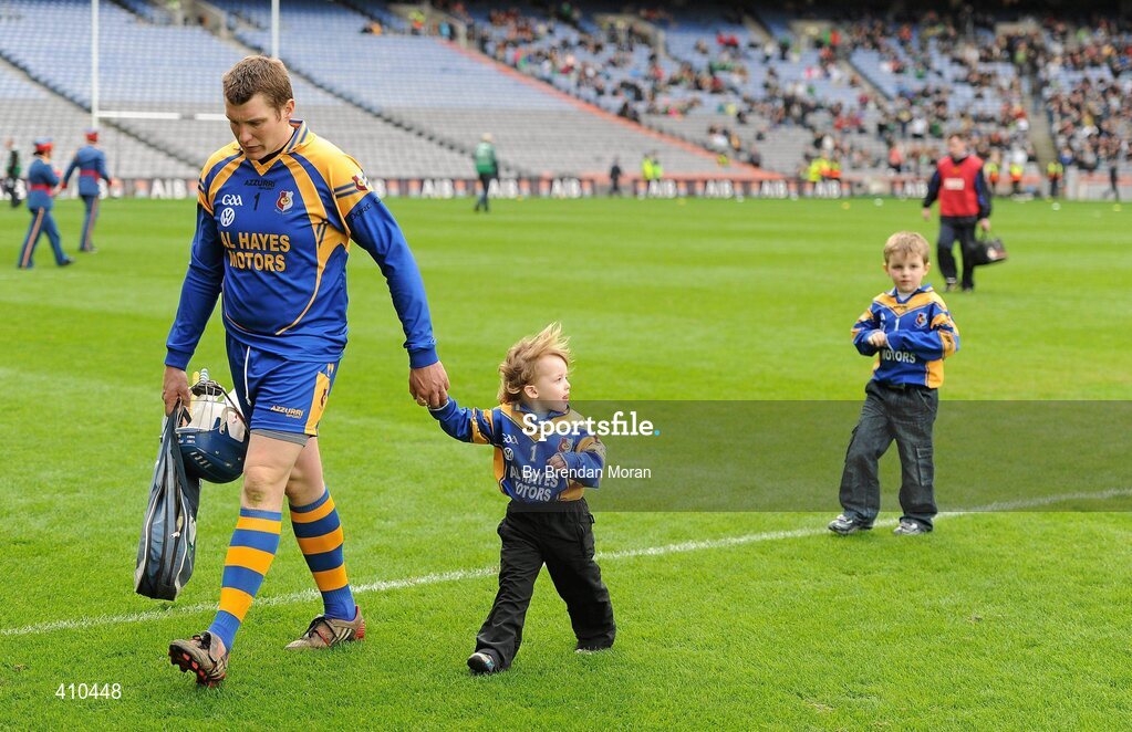 17 March 2010; Portumna goalkeeper Ivan Canning leaves the pitch after the game with his sons Andrew, age 3, and Nathan, age 5. AIB GAA Hurling All-Ireland Senior Club Championship Final, Ballyhale Shamrocks v Portumna, Croke Park, Dublin. Picture credit: Brendan Moran / SPORTSFILE