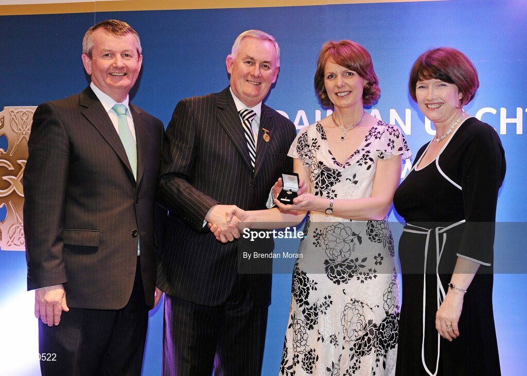 16 March 2009; Mary Donohue, Harps Camogie Club, Co. Laois, is presented with a GAA President's Award by Uachtarán CLG Criostóir Ó Cuana, in the company of Pol O Gallchoir, Ceannsai, TG4, and Joanne Lee, Head of Internal Cummunications, AIB.The Harps Camogie Club was founded in 1995 and Mary has been with it every step of the way. As well as fulfilling officer roles, she is ceaseless in fundraising and seeking out sponsors. GAA President’s Awards 2010, Croke Park, Dublin. Picture credit: Brendan Moran / SPORTSFILE