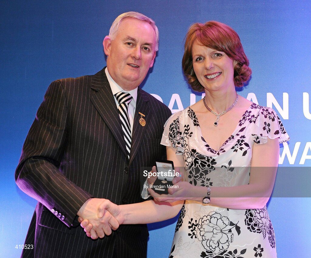 16 March 2009; Mary Donohue, Harps Camogie Club, Co. Laois, is presented with a GAA President's Award by Uachtarán CLG Criostóir Ó Cuana.The Harps Camogie Club was founded in 1995 and Mary has been with it every step of the way. As well as fulfilling officer roles, she is ceaseless in fundraising and seeking out sponsors. GAA President’s Awards 2010, Croke Park, Dublin. Picture credit: Brendan Moran / SPORTSFILE