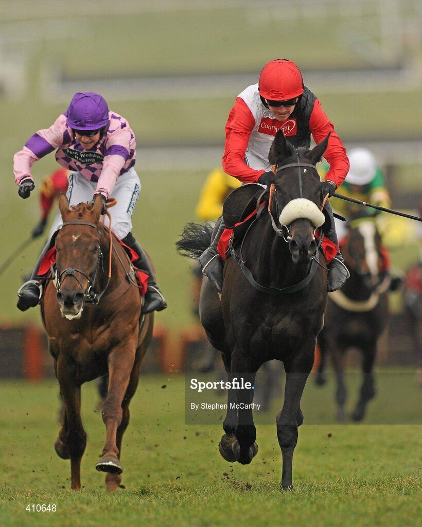 18 March 2010; Big Bucks, with Ruby Walsh up, right, on their way to winning the Ladbrokes World Hurdle, from second place Time for Rupert, with William Kennedy up. Cheltenham Racing Festival - Thursday. Prestbury Park, Cheltenham, Gloucestershire, England. Picture credit: Stephen McCarthy / SPORTSFILE
