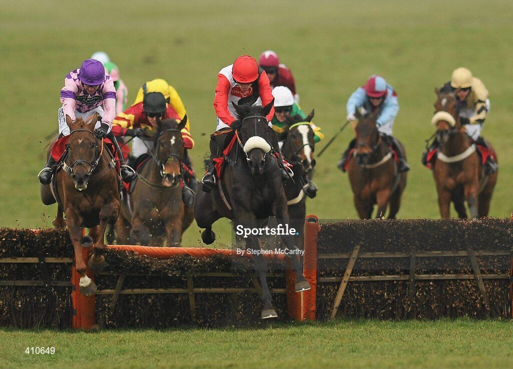 18 March 2010; Big Bucks, with Ruby Walsh up, jump the last on their way to winning the Ladbrokes World Hurdle, from second place Time for Rupert, with William Kennedy up, left. Cheltenham Racing Festival - Thursday. Prestbury Park, Cheltenham, Gloucestershire, England. Picture credit: Stephen McCarthy / SPORTSFILE