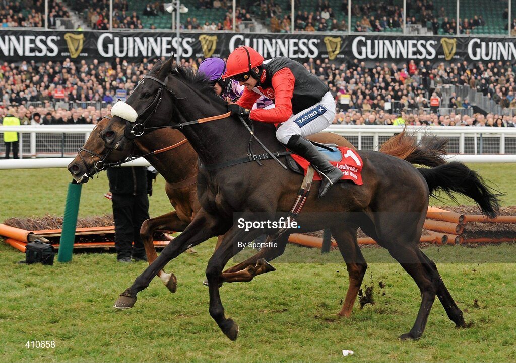 18 March 2010; Big Buck's, white and black silks, with Ruby Walsh up, jumps the last on their way to winning the Ladbrokes World Hurdle from second place Time for Rupert, with W.T. Kennedy up. Cheltenham Racing Festival - Thursday. Prestbury Park, Cheltenham, Gloucestershire, England. Photo by Sportsfile