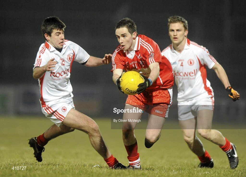 10 March 2010; Lee Moore, Derry, in action against Kieran Gervin, Tyrone. Cadbury Ulster GAA Football Under 21 Championship preliminary Round, Tyrone v Derry, Healy Park, Omagh, Co. Tyrone. Picture credit: Oliver McVeigh / SPORTSFILE