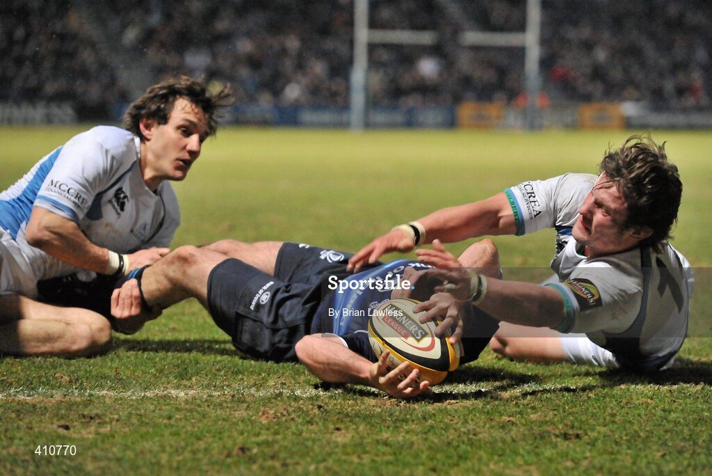 18 March 2010; Girvan Dempsey, Leinster, goes over for his side's second try despite the efforts of Peter Horne, right, and Bernardo Stortoni, Glasgow Warriors. Celtic League, Leinster v Glasgow Warriors, RDS, Ballsbridge, Dublin. Picture credit: Brian Lawless / SPORTSFILE