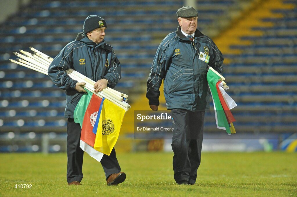 18 March 2010; Former Semple Stadium caretaker Jimmy Purcell, right, and current caretaker Philip Butler collect the flags after the game. Cadbury Munster GAA Football Under 21 Championship Semi-Final, Tipperary v Limerick, Semple Stadium, Thurles, Co. Tipperary. Picture credit: Diarmuid Greene / SPORTSFILE