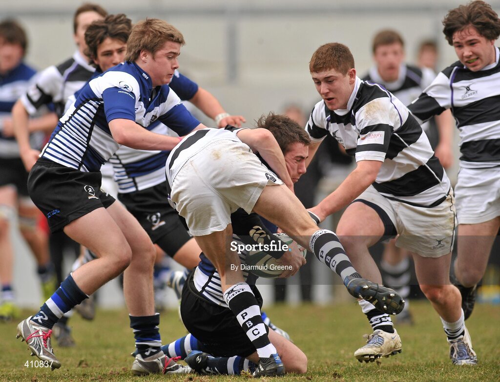 17 March 2010; JJ Hanrahan, supported by Donach McGillycuddy, Rockwell College, is tackled by Sean Og Murphy, left, and Daniel Horgan, PBC. Munster Schools Senior Cup Final, Rockwell College v PBC, Thomond Park, Limerick. Picture credit: Diarmuid Greene / SPORTSFILE