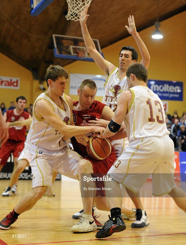 27 March 2010; Brian Clernon, Team Garvey St Mary's, in action against Paulius Peldzius, left, Thomas Costello, and Rimvydas Visockas, Titans. Basketball Ireland Men’s Division One Final, Titans, Galway v Team Garvey St Mary's, Castleisland, Co. Kerry, National Basketball Arena, Tallaght, Dublin. Picture credit: Brendan Moran / SPORTSFILE