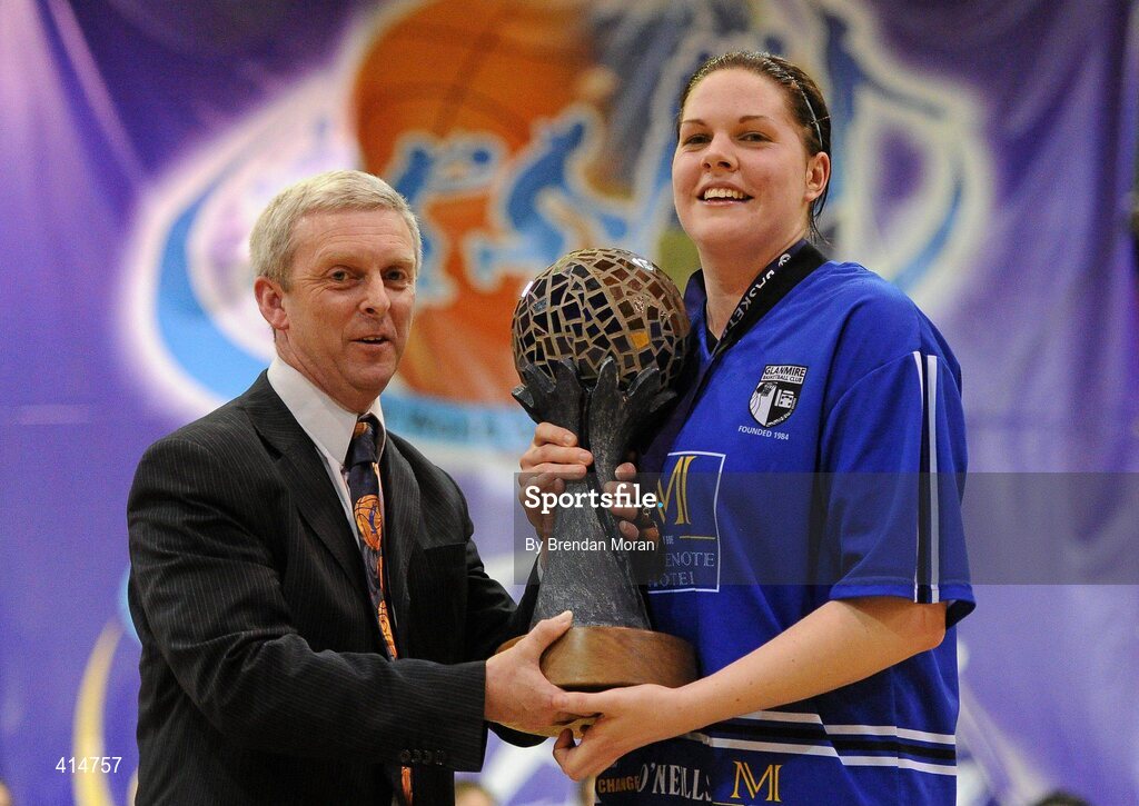 27 March 2010; Team Montenotte Hotel Cork captain Marie breen is presented with the Women's Superleague trophy by Timmy Murphy, President, Basketball Ireland. IrishSport.TV Women’s SuperLeague Final, Team Montenotte Hotel Cork v DCU Mercy, National Basketball Arena, Tallaght, Dublin. Picture credit: Brendan Moran / SPORTSFILE