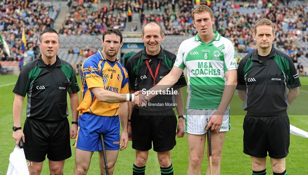 17 March 2010; Team captains Leo Smith, Portumna, and Eamonn Walsh, Ballyhale Shamrocks, shake hands in the company of referee Cathal McAllister, and linesmen James McGrath and Owen Elliott. AIB GAA Hurling All-Ireland Senior Club Championship Final, Ballyhale Shamrocks v Portumna, Croke Park, Dublin. Picture credit: Brendan Moran / SPORTSFILE