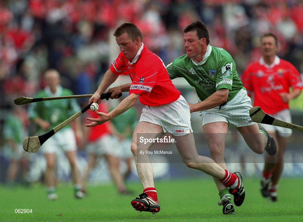 27 May 2001; John O'Mahony of Cork is tackled by PJ Garvey of Limerick during the Guinness Munster Senior Hurling Championship Quarter-Final match between Cork and Limerick at Páirc Uí Chaoimh in Cork. Photo by Ray McManus/Sportsfile