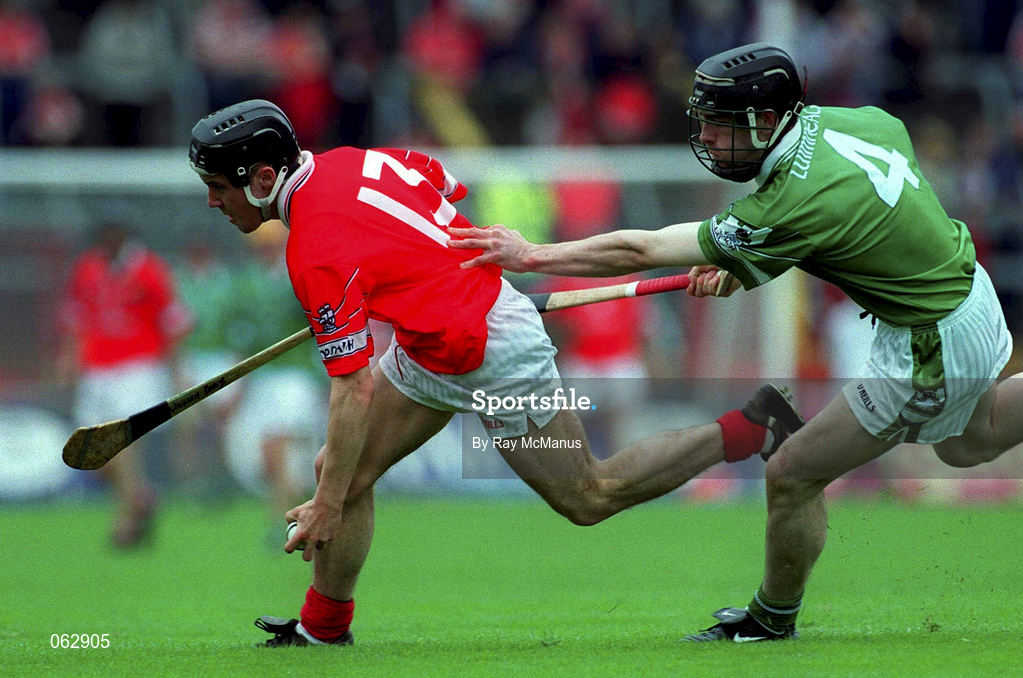 27 May 2001; William Deasy of Cork is tackled by Johnny Murphy of Limerick during the Guinness Munster Senior Hurling Championship Quarter-Final match between Cork and Limerick at Páirc Uí Chaoimh in Cork. Photo by Ray McManus/Sportsfile