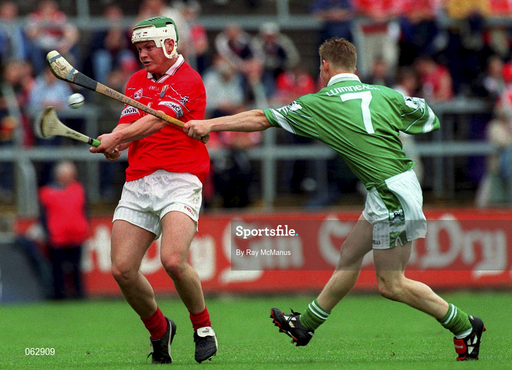 27 May 2001; Niall McCarthy of Cprk is tackled by Damien Browne of Limerick during the Guinness Munster Senior Hurling Championship Quarter-Final match between Cork and Limerick at Páirc Uí Chaoimh in Cork. Photo by Ray McManus/Sportsfile