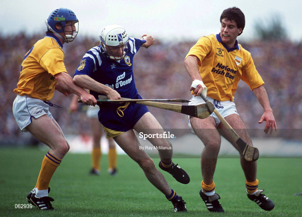 4 July 1993; Ger O'Loughlin of Clare, in action against Paul Delaney, left, and Raymie Ryan of Tipperary during the Munster Senior Hurling Championship Final match between Clare and Tipperary at the Gaelic Grounds in Limerick. Photo by Ray McManus/Sportsfile