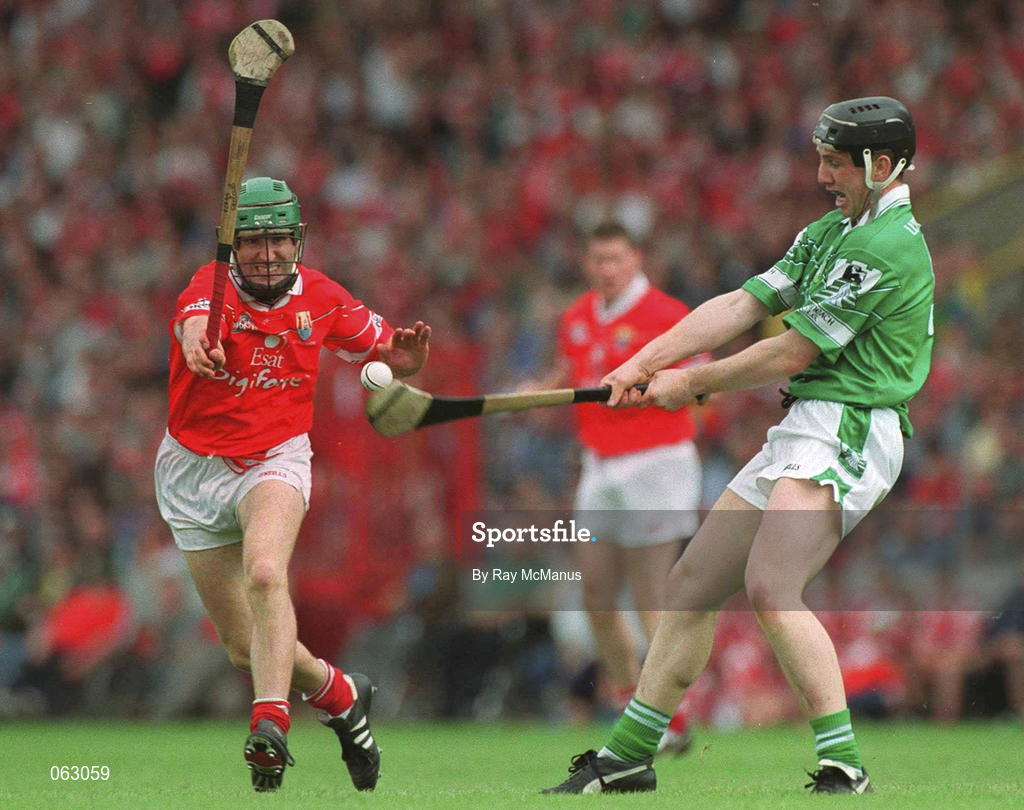 27 May 2001; James Moran of Limerick clears under pressure from Jerry O'Connor of Cork during the Guinness Munster Senior Hurling Championship Quarter-Final match between Cork and Limerick at Páirc Uí Chaoimh in Cork. Photo by Ray McManus/Sportsfile