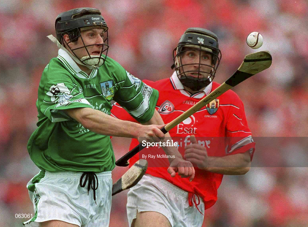 27 May 2001; Jack Foley of Limerick races goalwards ahead of Ben O'Connor of Cork during the Guinness Munster Senior Hurling Championship Quarter-Final match between Cork and Limerick at Páirc Uí Chaoimh in Cork. Photo by Ray McManus/Sportsfile
