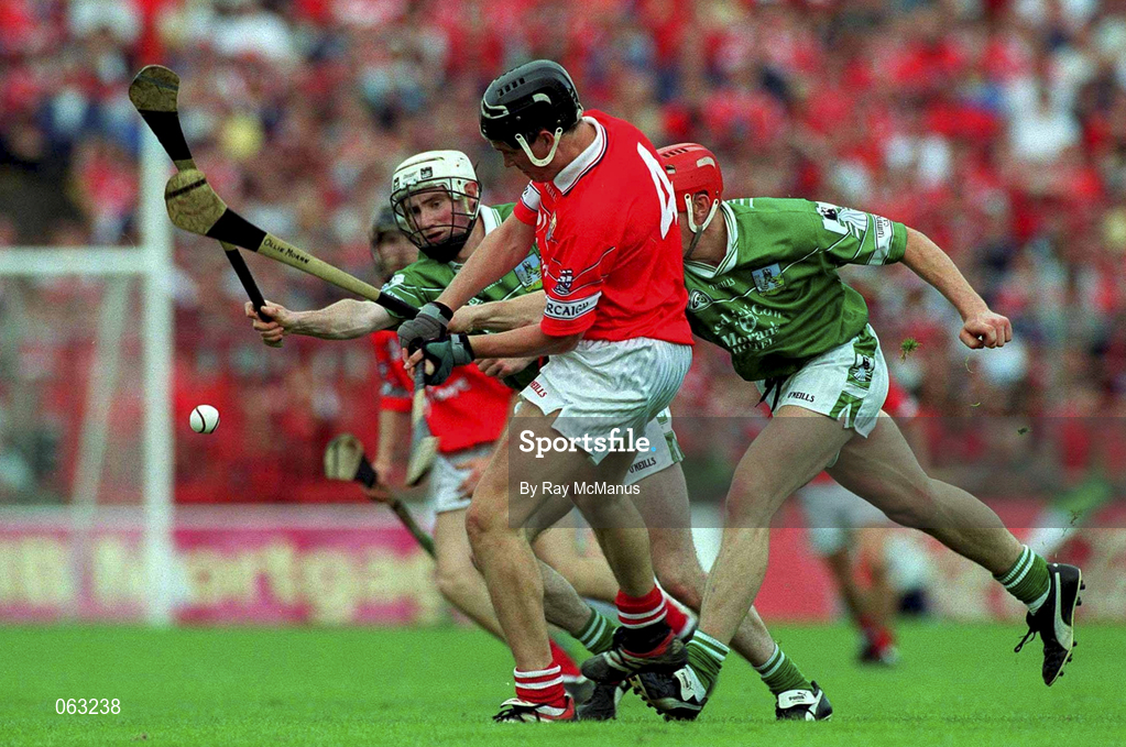 27 May 2001; John Browne of Cork is tackled by Paul O'Grady, left, and team-mate Ollie Moran of Limerick during the Guinness Munster Senior Hurling Championship Quarter-Final match between Cork and Limerick at Páirc Uí Chaoimh in Cork. Photo by Ray McManus/Sportsfile