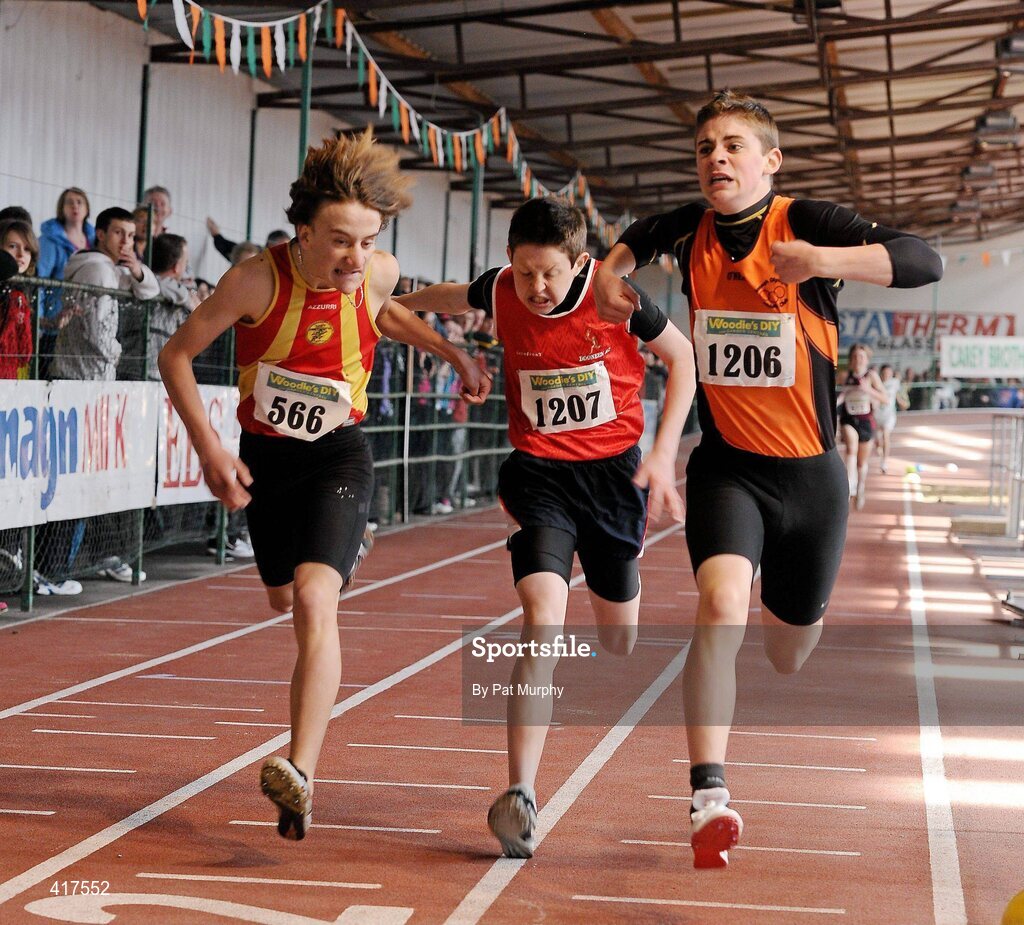 10 April 2010; Liam Finn from Nenagh Olympic AC crosses the finish line to win the U15 Boys 800m ahead of second placed Conor Murray, Tallaght AC, left, and third placed Dylan Sheehan, Dooneen AC, centre. Woodie's DIY Juvenile Indoor Championships, Nenagh Indoor Arena, Nenagh, Co. Tipperary. Picture credit: Pat Murphy / SPORTSFILE