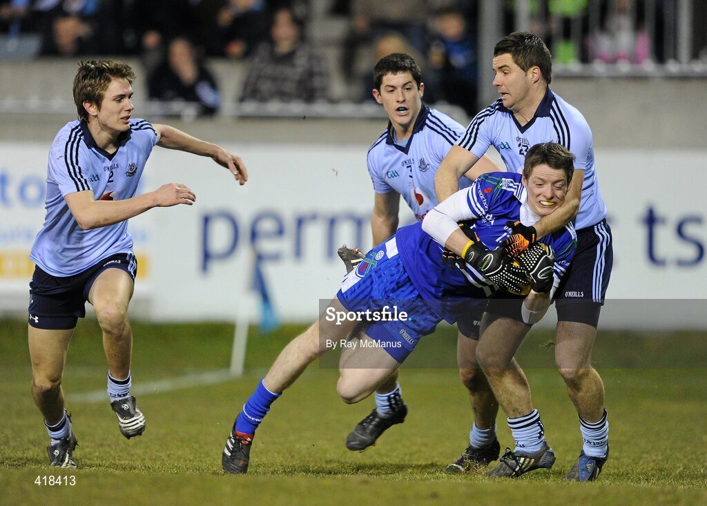 13 March 2010; Conor McManus, Monaghan, is tackled by, from left, Michael Fitzsimons, Rory O'Carroll and Brendan McMenamon, Dublin. Allianz GAA Football National League, Division 1, Round 4, Dublin v Monaghan, Parnell Park, Dublin. Picture credit: Ray McManus / SPORTSFILE