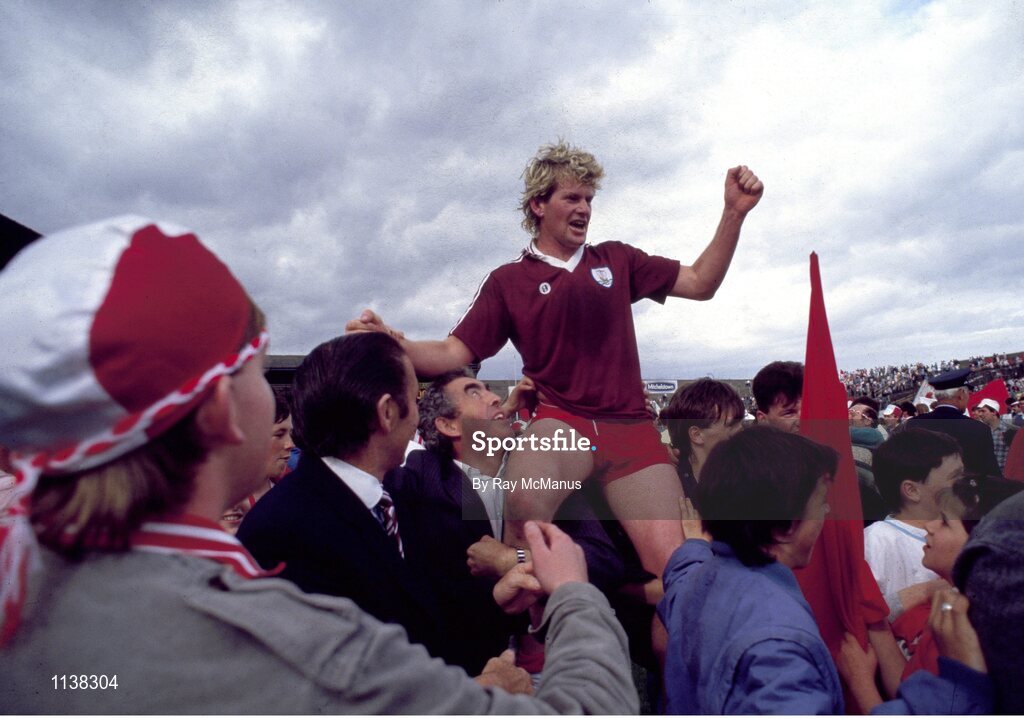 17 August 1986; Plunkett Donaghy of Tyrone celebrates with supporters after their side's victory in the All-Ireland Football Championship Semi-Final match between Tyrone and Galway at Croke Park, Dublin. Photo by Ray McManus/Sportsfile