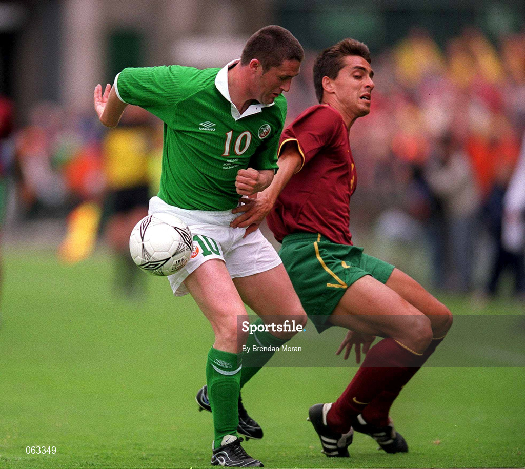 2 June 2001; Robbie Keane of Republic of Ireland in action against Roberto Severo of Portugal during the FIFA World Cup 2002 Group 2 Qualifier match between Republic of Ireland and Portugal at Lansdowne Road in Dublin. Photo by Brendan Moran/Sportsfile