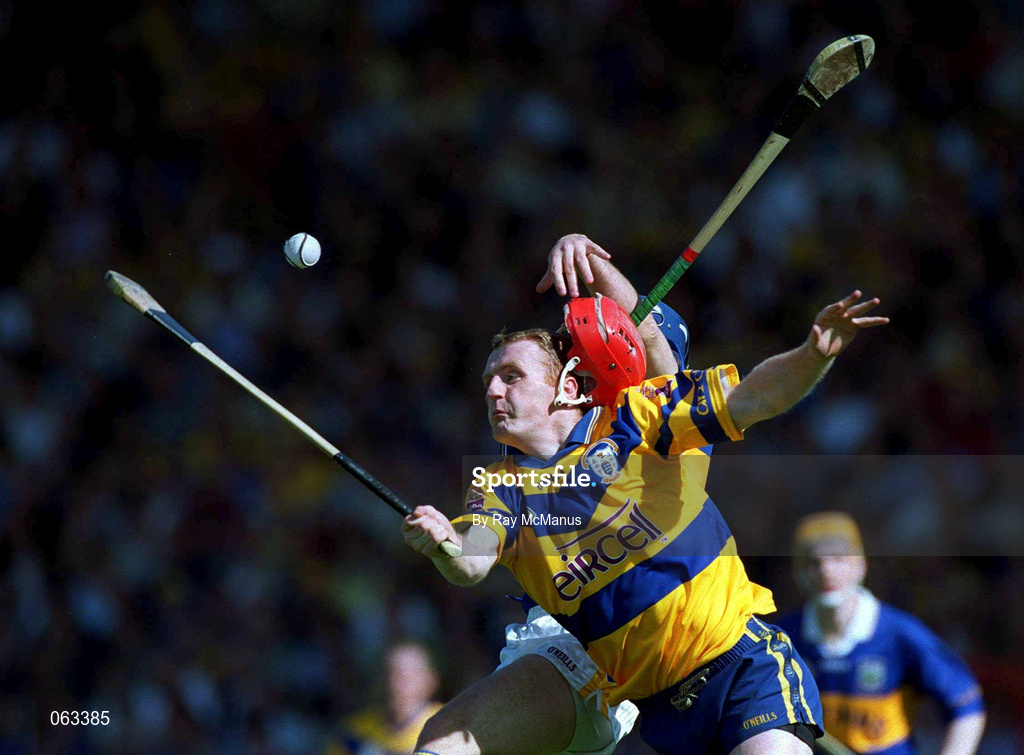 3 June 2001; Brian Lohan of Clare loses his helmet in a tussle for possession with John Leahy of Tipperary, which caused John Leahy's injury, during the Guinness Munster Senior Hurling Championship Semi-Final match between Tipperary and Clare at Páirc Uí Chaoimh in Cork. Photo by Ray McManus/Sportsfile