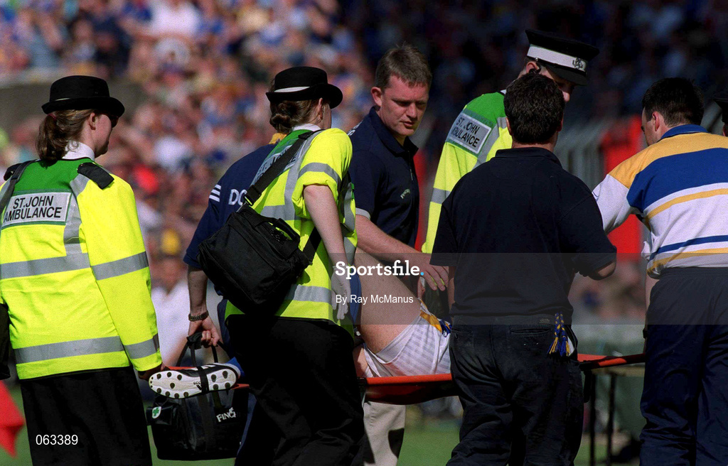 3 June 2001; Tipperary manager Nicky English watches as John Leahy of Tipperary is taken off the field on a stretcher with a knee injury during the Guinness Munster Senior Hurling Championship Semi-Final match between Tipperary and Clare at Páirc Uí Chaoimh in Cork. Photo by Ray McManus/Sportsfile